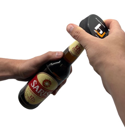 Hockey puck with opener Hejduk